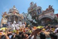 Devotees make their offering for lord Murugan in silver chariot in front Sri Kamatchi Amman Temple. Royalty Free Stock Photo